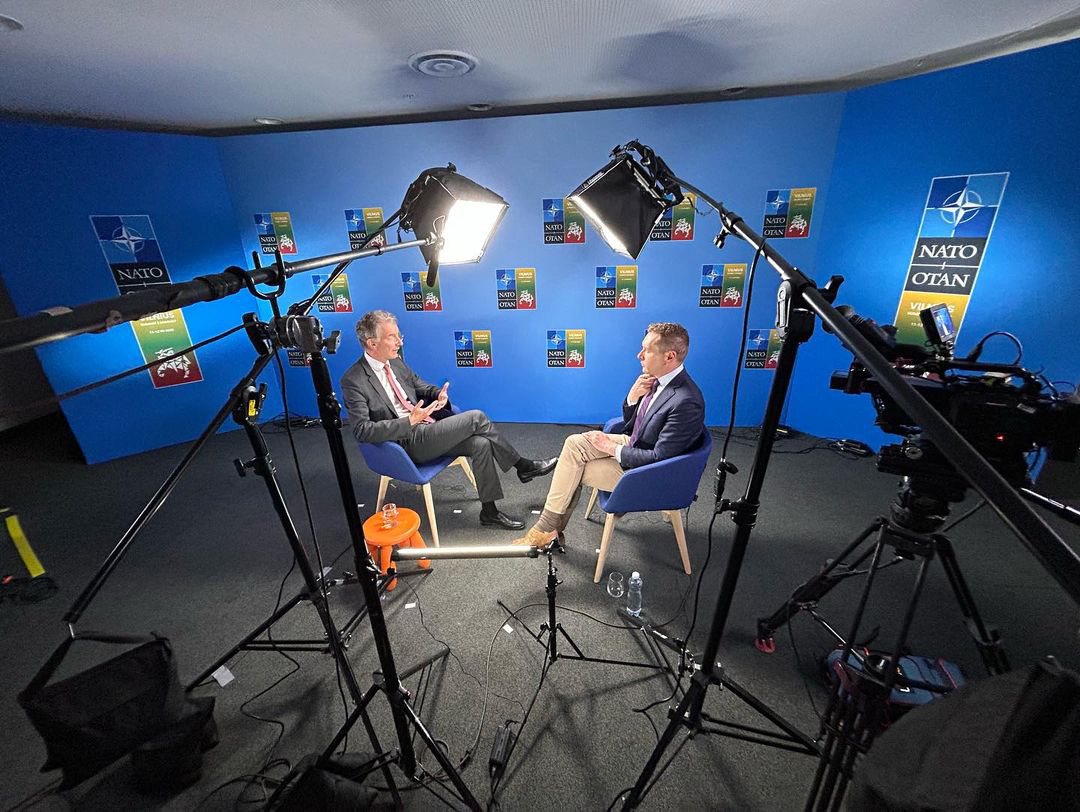 Josh Lederman interviewing an official at the NATO Summit in Vilnius